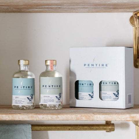 Gift set of Pentire Adrift and Pentire Seaward with a bottle of each in a white Pentire box and a bottle of each on display in front of the box