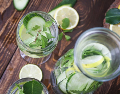 non-alcoholic cucumber mint spritz in a glass and pitcher