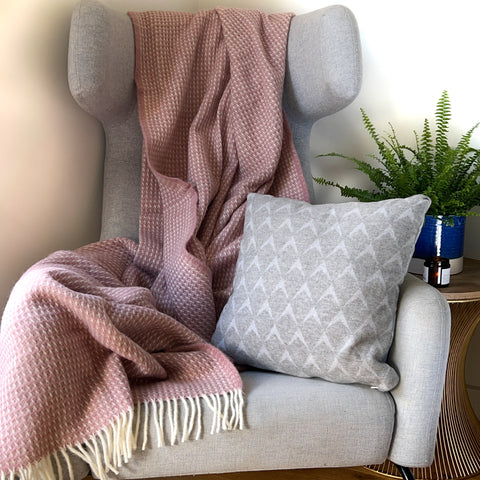 Wool blanket and cushion on chair
