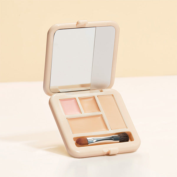 Double cover concealer palette that covers with cream and fixes with powder