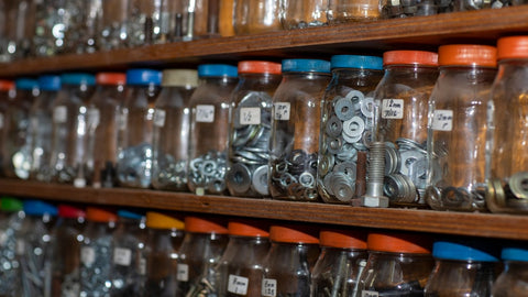 Old glass jars storing hardware supplies