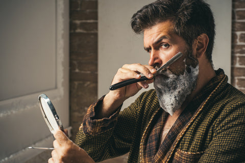 Man shaving with razor