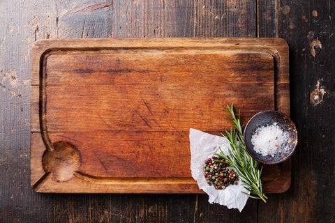 Wooden chopping board with seasoning