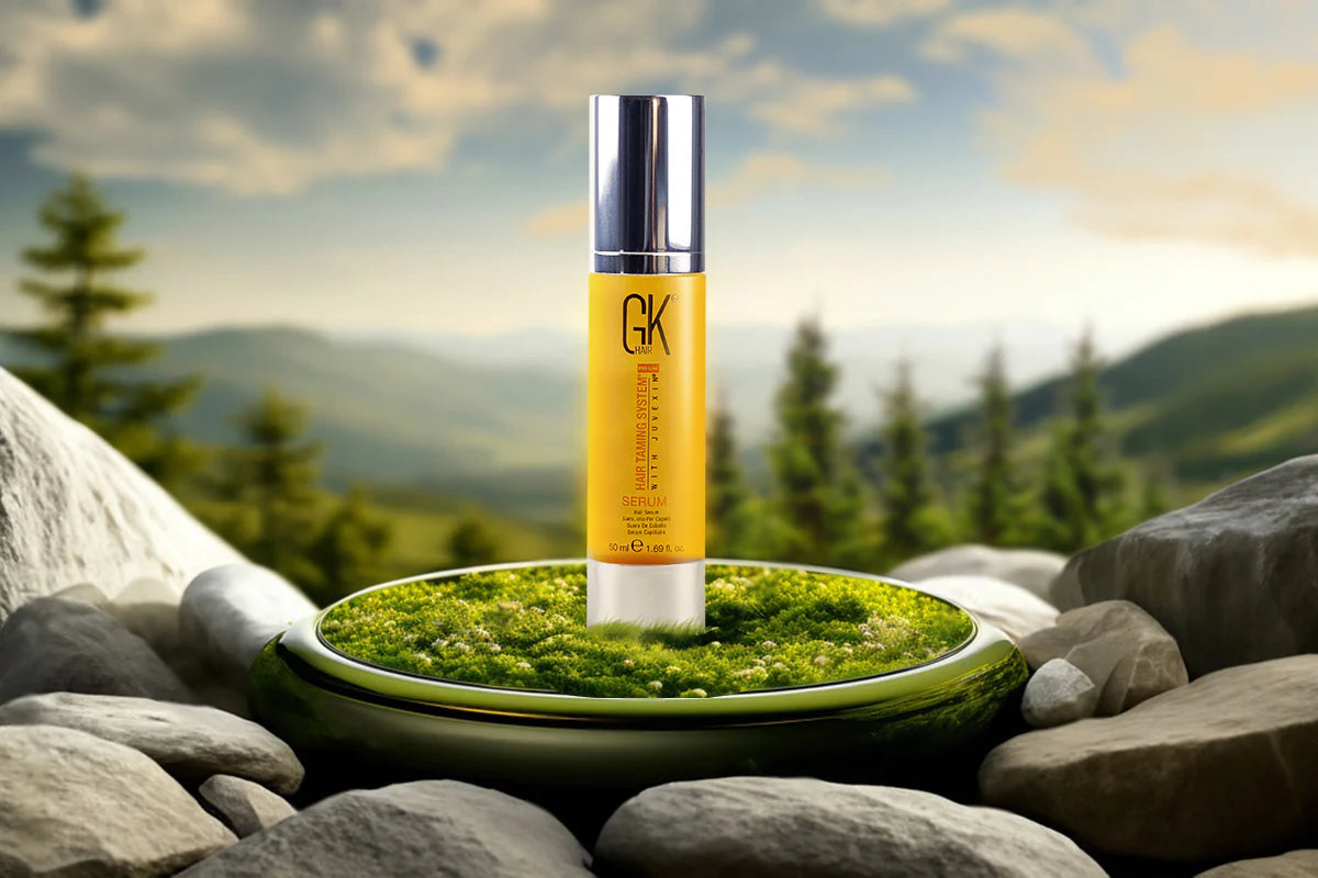 Bottle of GK Hair vegan serum elegantly displayed in a natural setting