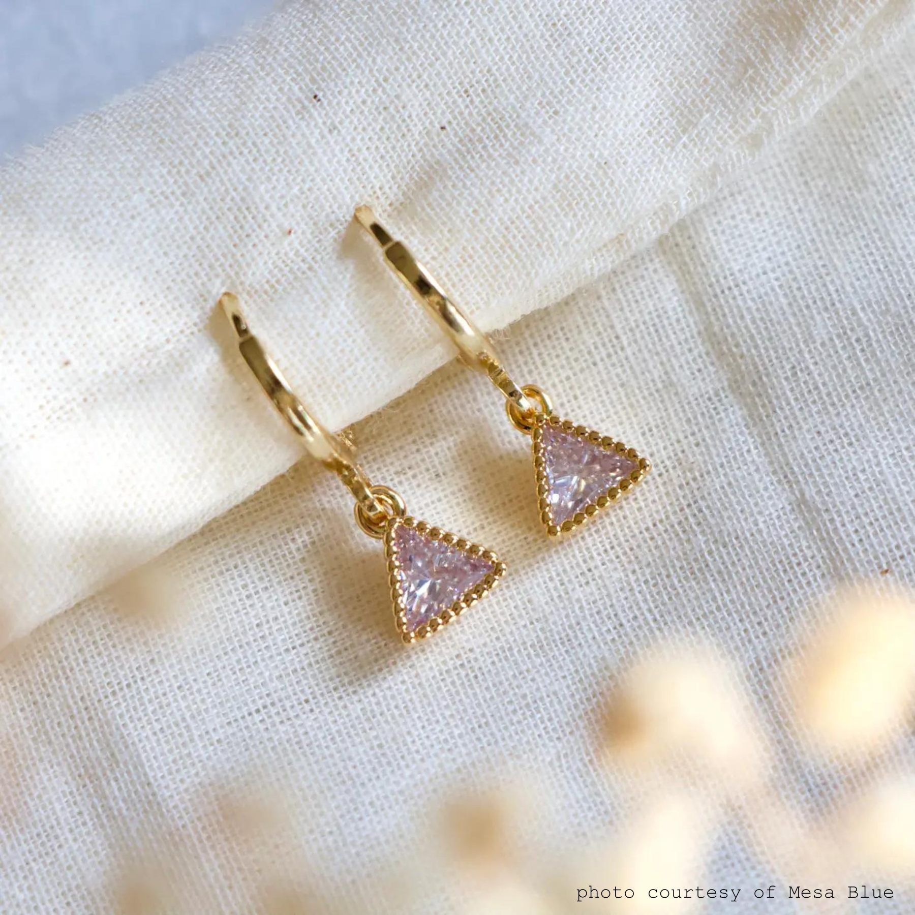 The cz triangle huggie earrings by mesa blue sold at harbour thread