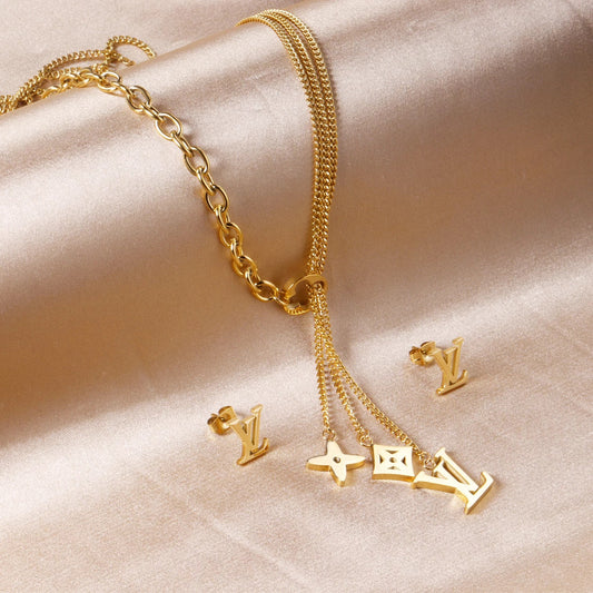 Louis Vuitton gold necklace and earring set