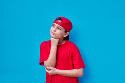 portrait-of-pensive-boy-in-red-cap-and-t-shirt-wit-2023-11-27-05-14-54-utc.jpg__PID:7c18634f-66d1-47a8-9847-1a498cb7a386
