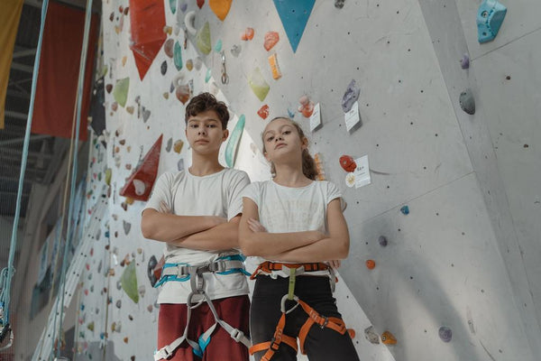 Kids at an indoor rock climbing gym