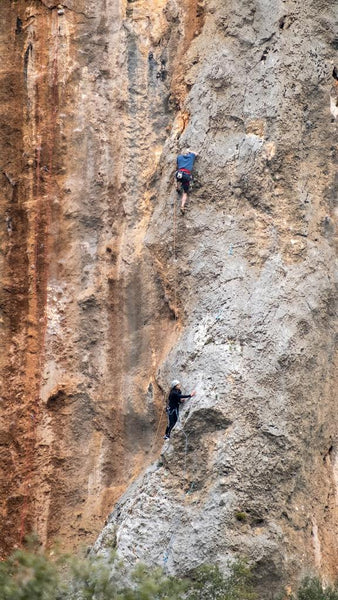 Trad climbing outdoors on rock structure