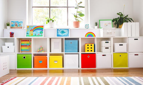 kids bedroom shelves with bright cubbies and a plant and rug