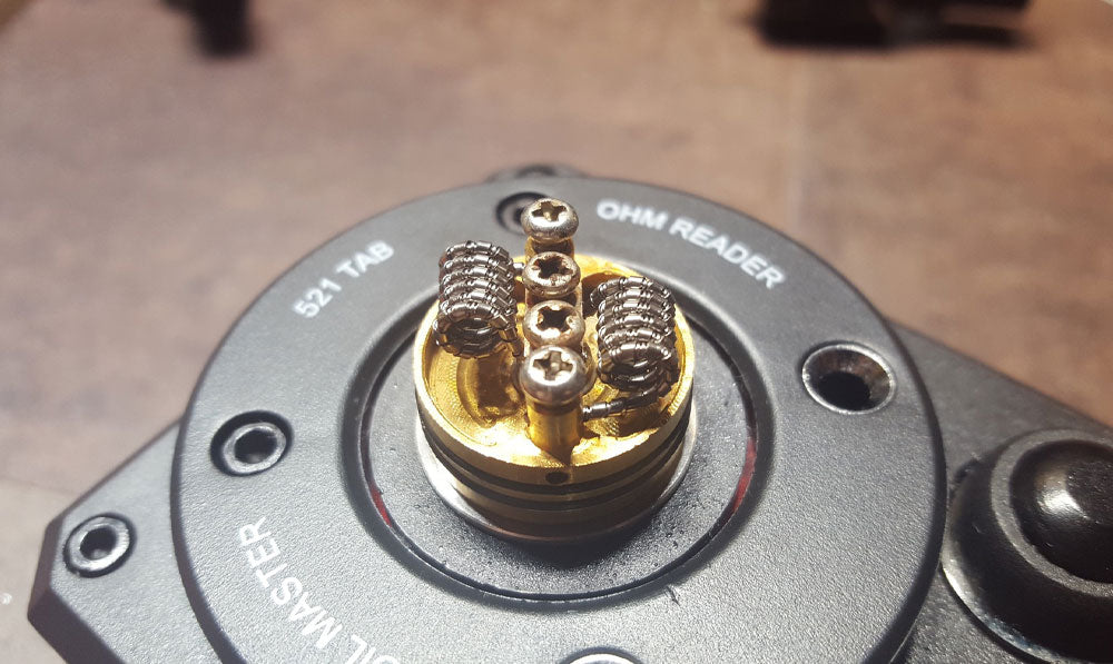 Close up of vape coil over brown flooring