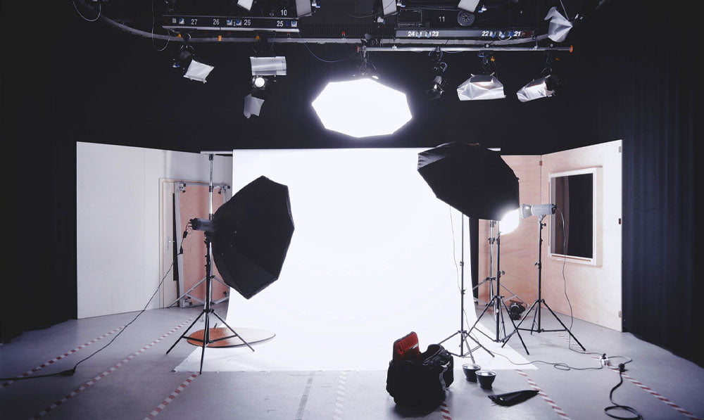 Image of a photo studio with lights and reflectors active