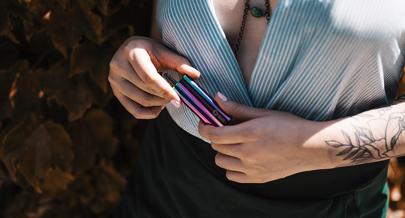 woman with tattoo holding the Full Color Sutra Auto outside