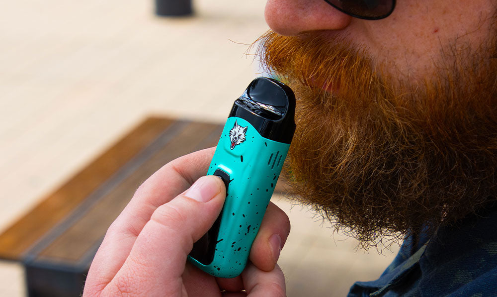 man with beard holding the Wulf Flex at park