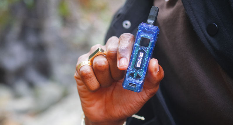 Man holding Wulf X-Ray UNI Pro in front of creek