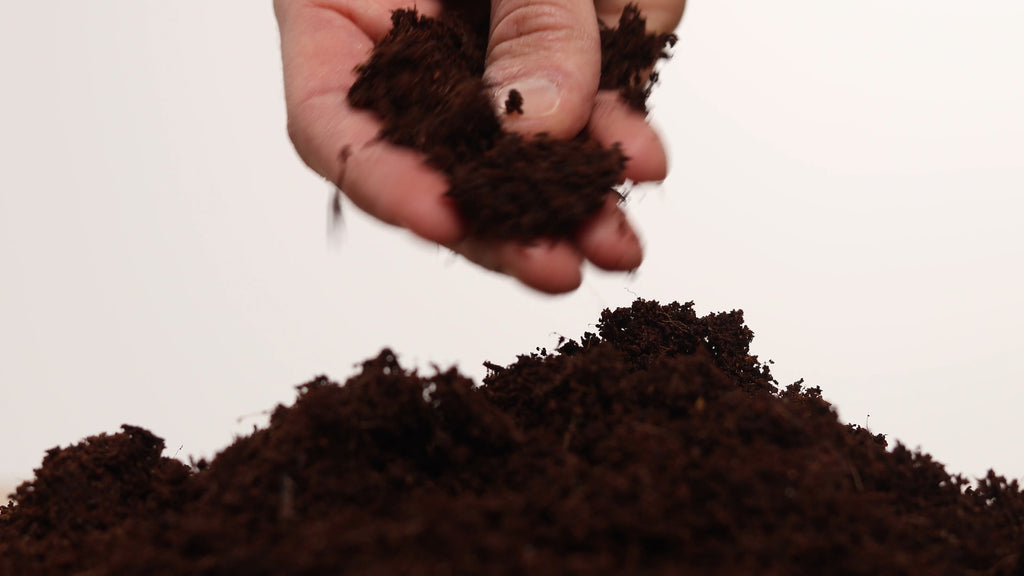 crumbly damp coco coir cover material for compost toilet with hand