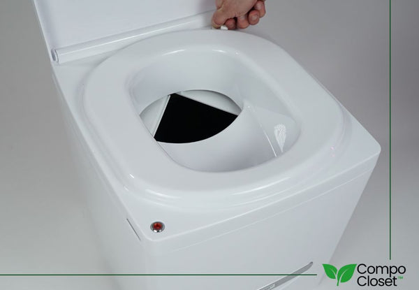 Hand opening urine diverter on cuddy composting toilet by compo closet