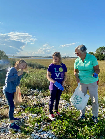 Karin's daughters collecting oysters with their grandmother