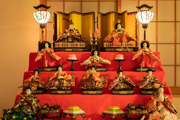 A four-tiered hinakazari with different hina dolls, a typical sight during Hina Festival