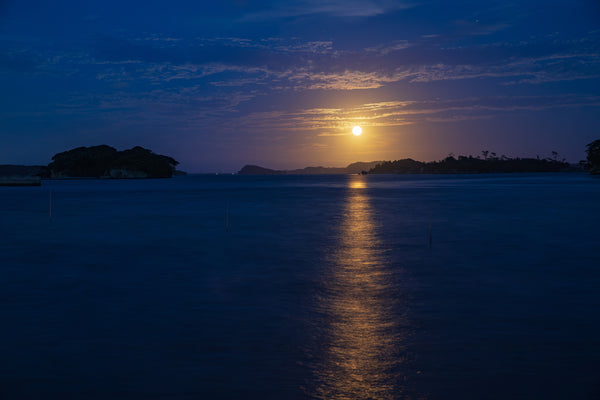 The Golden Road of Matsushima features a full moon's light reflected on the waters of Matsushima