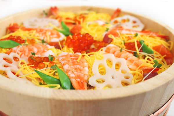 Chirashizushi, scattered with lotus roots, shrimps and fried eggs atop rice soaked in vinegar