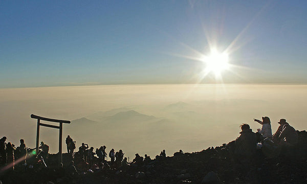 Viewing the sunrise from Mount Fuji