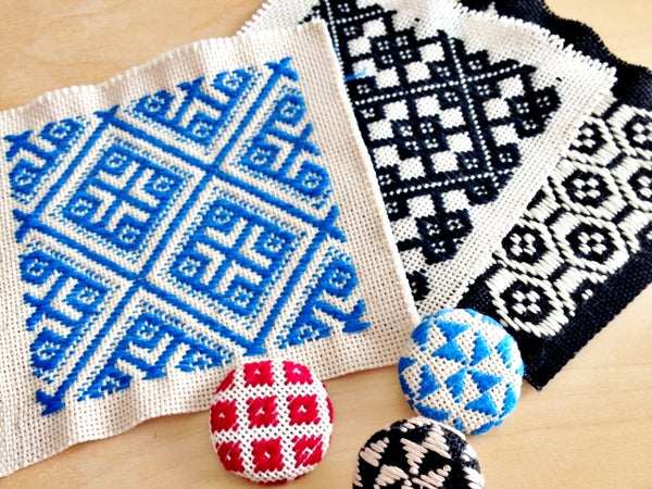 Kogin zashi embroidered handicrafts in the shape of coasters and pins from Japan