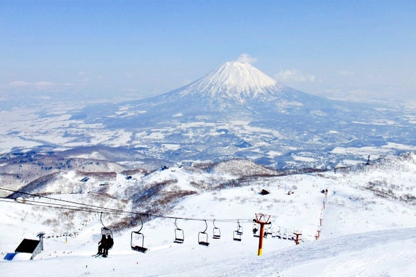 Ski resort in Niseko with a snowy Mount Yotei in the background