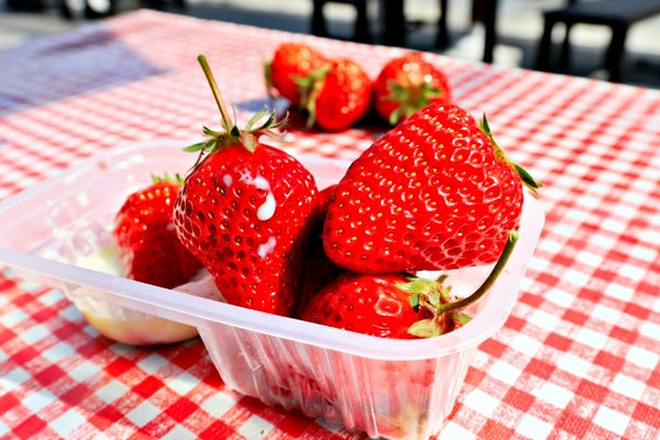 Fresh strawberries in a tub