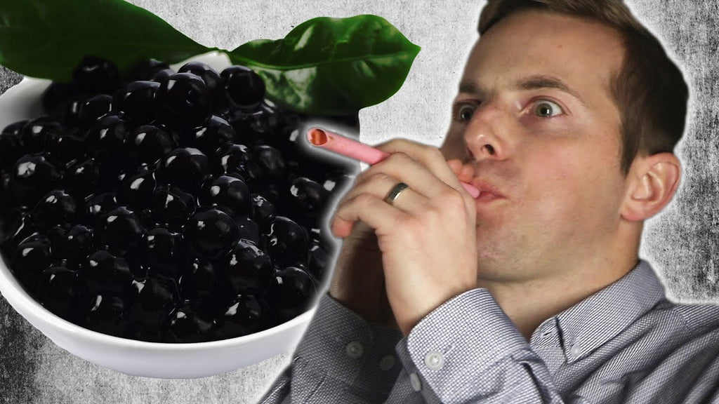 YouTube video cover photo of a man shooting boba as spitballs.