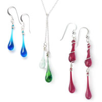 Solaris Earrings in turquoise, Duet Lariat in soda fountain recycled glass, and Gemina Earrings in garnet