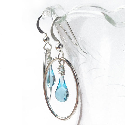 A modern take on the traditional cameo - pale blue teardrop earrings framed in an oval of recycled sterling silver.