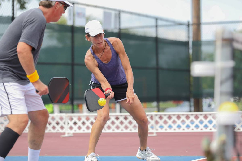 Doubles team playing pickleball.