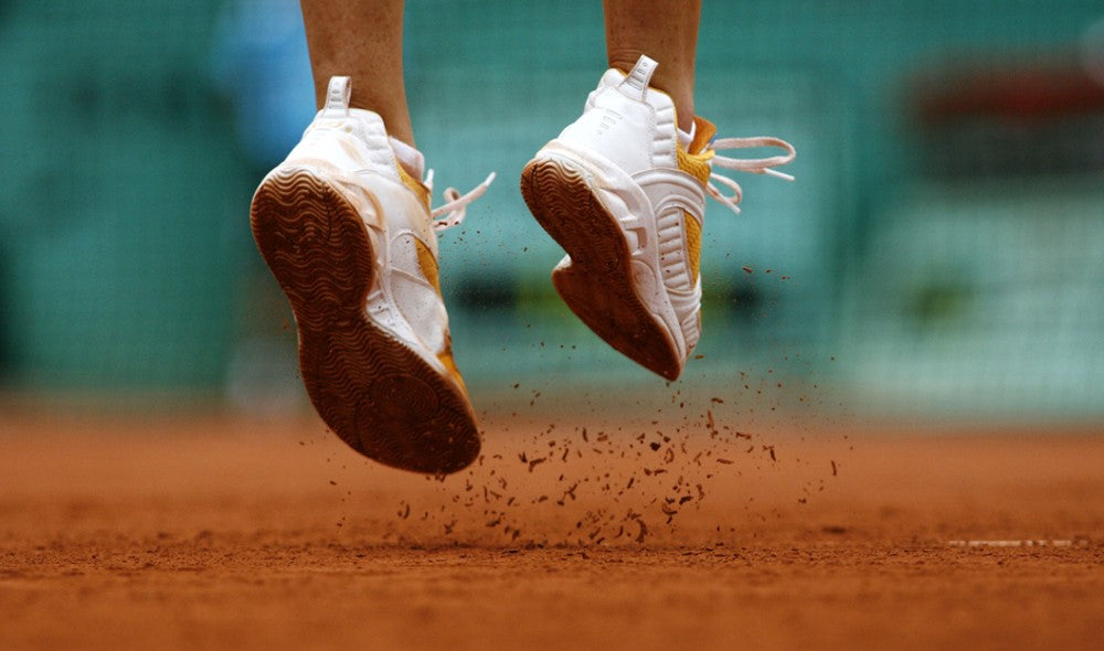 man jumping on dirt