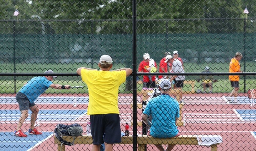 old friends playing pickleball