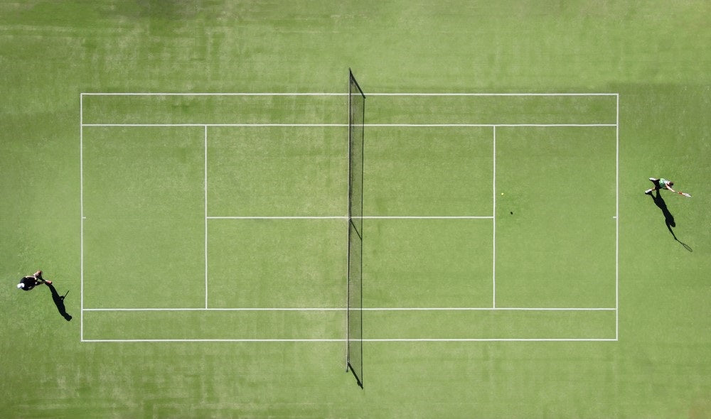 players playing tennis in court