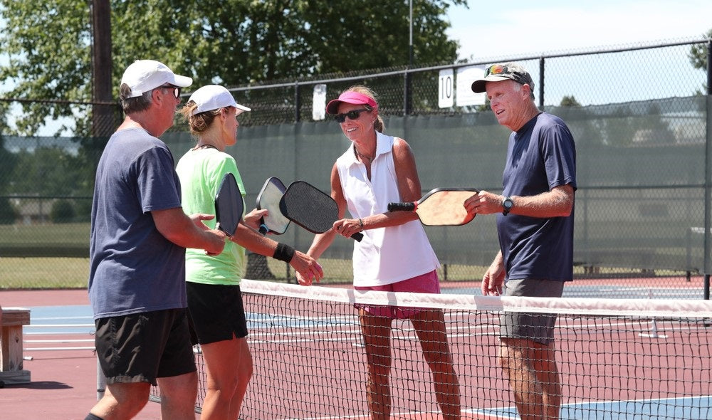 players shaking hands after pickleball game