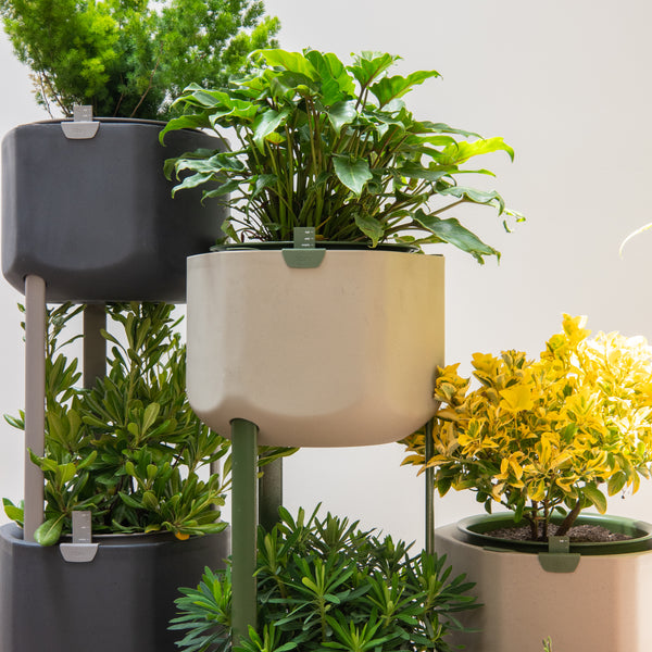 Stacked self-watering planters make for lush plants