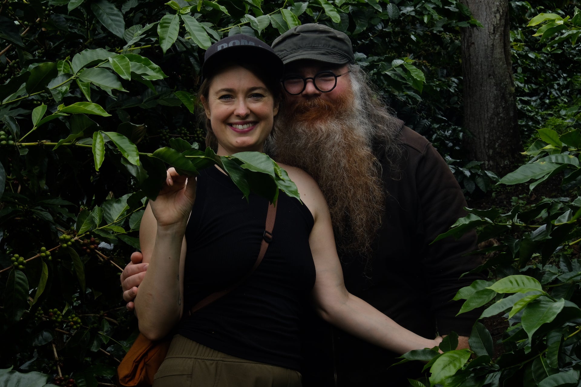 WideFormat Emily and Michael smiling in coffee field in Peru.