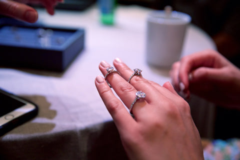 Trying on engagement rings at Mark Patterson booth