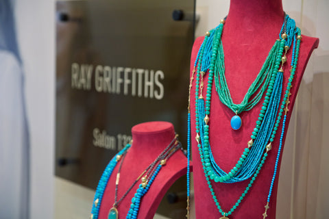 Photo of pink necklace forms with blue turquoise necklaces from Ray Griffiths draped all over. 