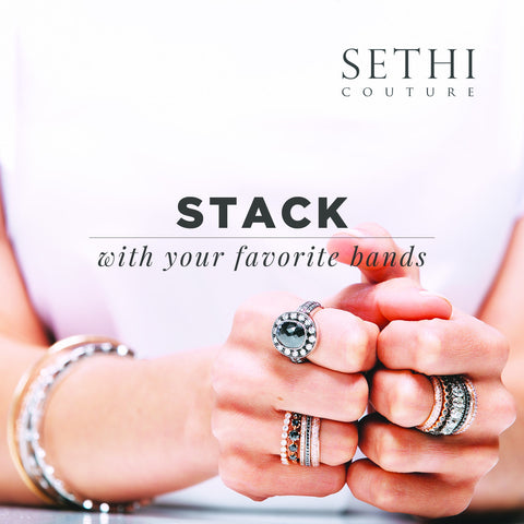 Image of womans hands and arms with many rings and bracelets. Top right corner says "Sethi Couture" Middle of page says "stack with your favorite bands"