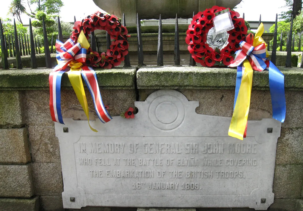 Statue's pedestal, with fresh garlands and ribbons