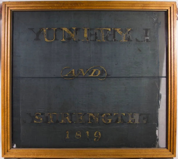 Back of Liberty and Fraternity flag, which reads Unity and Strength