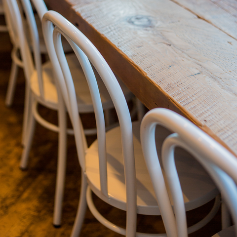 Cafe chairs at a wooden table