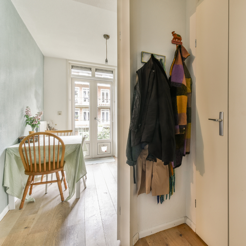 White corridor with hanging coats