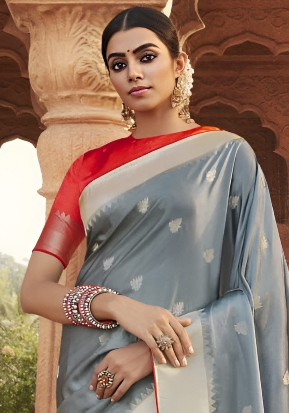 Best embroidered designer gray color silk saree with contrast blouse.