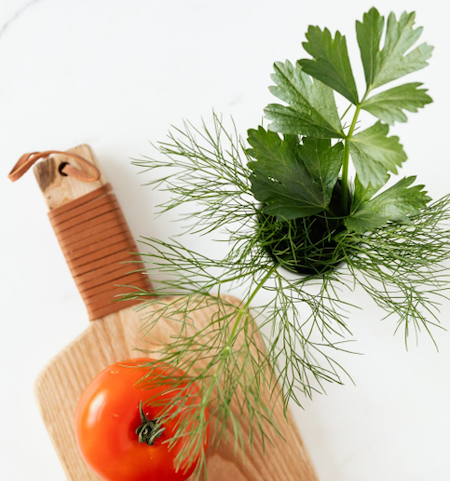 Fennel and Other Herbs on a Wooden Chopping Board