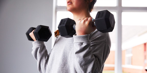 Woman lifting dumbbell