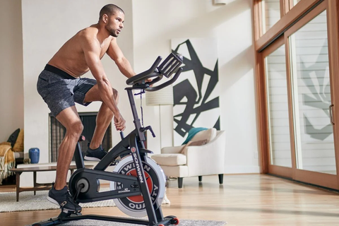 Man working out on exercise bike